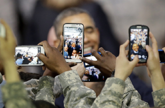 military person using smart phone